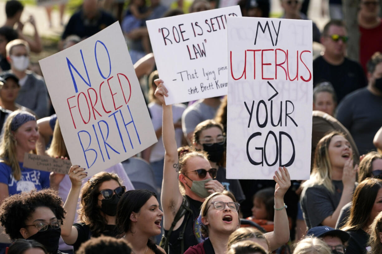 FILE - Abortion-rights protesters cheer at a rally, June 24, 2022, in Des Moines, Iowa. A new poll from from AAPI Data and The Associated Press-NORC Center for Public Affairs Research shows that Asian Americans, Native Hawaiians and Pacific Islanders in the U.S. are highly supportive of legal abortion, even in situations where the pregnant person wants an abortion for any reason.