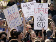 FILE - Abortion-rights protesters cheer at a rally, June 24, 2022, in Des Moines, Iowa. A new poll from from AAPI Data and The Associated Press-NORC Center for Public Affairs Research shows that Asian Americans, Native Hawaiians and Pacific Islanders in the U.S. are highly supportive of legal abortion, even in situations where the pregnant person wants an abortion for any reason.