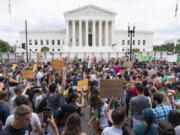 FILE - Protesters gather outside the Supreme Court in Washington, Friday, June 24, 2022, after the Supreme Court ended constitutional protections for abortion that had been in place nearly 50 years. More than a quarter of female Black voters describe abortion as their top issue in this year&rsquo;s presidential election, a new survey out Thursday from health policy research firm KFF finds.