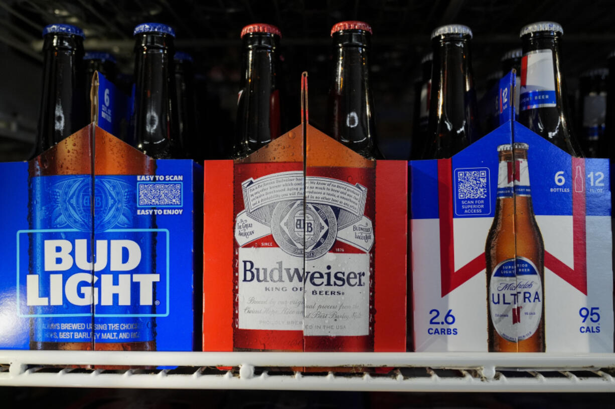 Six-packs of Bud Light, Budweiser and Michelob Ultra are displayed at a liquor store, Wednesday, Feb. 28, 2024, in Fairfield, Calif. Budweiser brewer Anheuser-Busch has reached a contract agreement with the Teamsters union that avoids a strike at its U.S. plants. The union had threatened a strike at the brewer&rsquo;s 12 U.S. plants if an agreement on a new five-year contract wasn&rsquo;t reached by 11:59 p.m. EST Thursday. (AP Photo/Godofredo A.