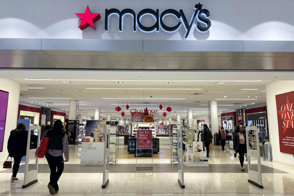 FILE - Shoppers enter a Macy&rsquo;s department store in Bay Shore, Long Island, New York, Dec. 12, 2023. Arkhouse Management and Brigade Capital Management announced Sunday, March 3, 2024, that they are upping their offer to acquire Macy&rsquo;s in a deal now valued at $6.6 billion.