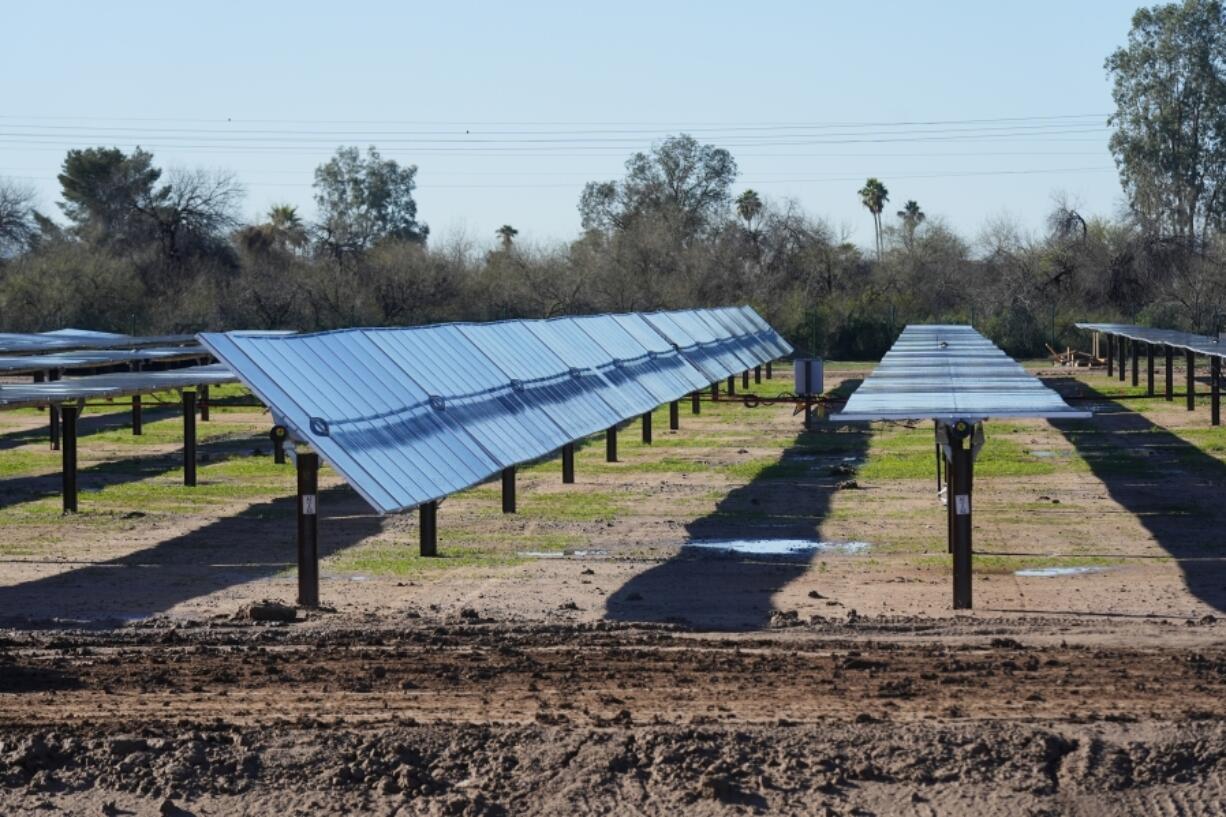 Rows of solar panels sit at Orsted&rsquo;s Eleven Mile Solar Center lithium-ion battery storage energy facility Thursday, Feb. 29, 2024, in Coolidge, Ariz. Batteries allow renewables to replace fossil fuels like oil, gas and coal, while keeping a steady flow of power when sources like wind and solar are not producing. (AP Photo/Ross D.