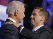 FILE - Then-Democratic vice presidential candidate Sen. Joe Biden, D-Del., left, embraces his son Beau Biden on stage at the Democratic National Convention in Denver, Aug. 27, 2008.