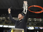 Long Beach State head coach Dan Monson participates in a net cutting ceremony after his team played an NCAA college basketball game against UC Davis in the championship of the Big West Conference men&rsquo;s tournament Saturday, March 16, 2024, in Henderson, Nev. Long Beach State won 74-70.