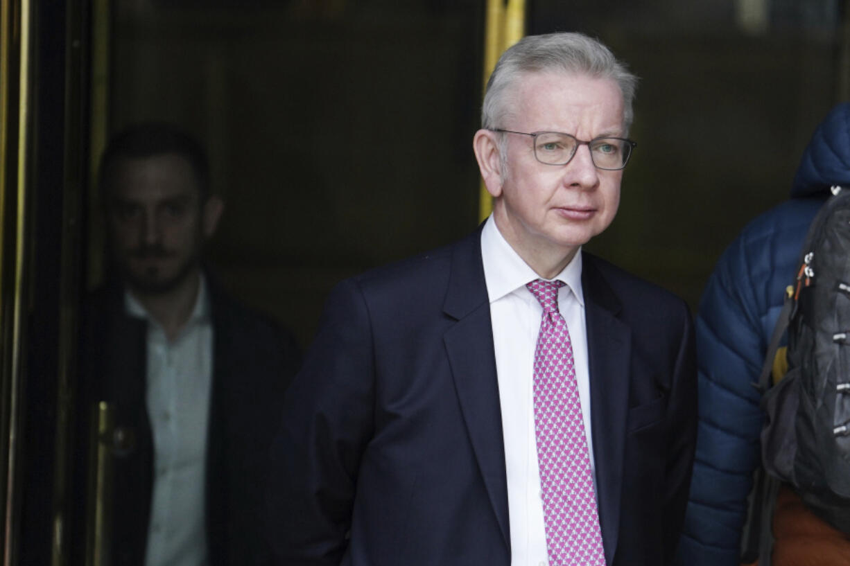 Britain&rsquo;s Minister for Levelling Up, Housing and Communities, Michael Gove, leaves the Millbank Studios in central London after taking part in the morning interview rounds, Thursday March 14, 2024. The British government published an official definition of &ldquo;extremism&rdquo; on Thursday, and said groups that get the label will be barred from receiving government funding. The government did not provide examples of extremist groups, and is not expected to publish a list of such organizations for some weeks.