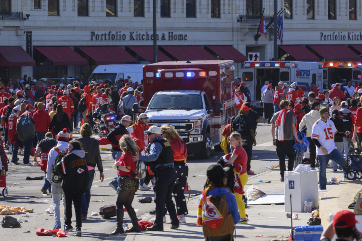 FILE - Police clear the area following a shooting at the Kansas City Chiefs NFL football Super Bowl celebration in Kansas City, Mo., Wednesday, Feb. 14, 2024. Three men from Kansas City, Mo.,, face firearms charges, including gun trafficking, after an investigation into the mass shooting during the Kansas City Chiefs&rsquo; Super Bowl parade and rally, federal prosecutors said Wednesday, March 13, 2024.