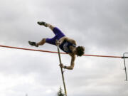 Eli Wenger of Columbia River clears the bar in the boys pole vault  in a 2A Greater St. Helens League track and field meet at Columbia River High School on Tuesday, March 26, 2024.