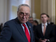 Senate Majority Leader Chuck Schumer, D-N.Y., speaks to reporters at the Capitol in Washington, Tuesday, March 12, 2024. (AP Photo/J.