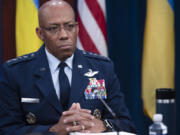 FILE - Chairman of the Joint Chiefs of Staff Air Force Gen. CQ Brown, participates in a virtual Ukraine Defense Contact Group (UDCG) meeting Nov. 22, 2023, at the Pentagon in Washington. Brown is visiting U.S. weapon factories in Oklahoma and Arkansas to address concerns over billions of dollars being sent overseas to Ukraine and other allies when there are so many needs at home.