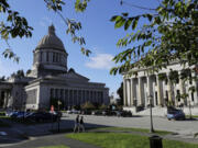 The afternoon sun illuminates the Legislative Building, left, at the Capitol in Olympia in 2018. The Legislature on Wednesday approved a supplemental budget that capital budget that includes money for projects in Southwest Washington.