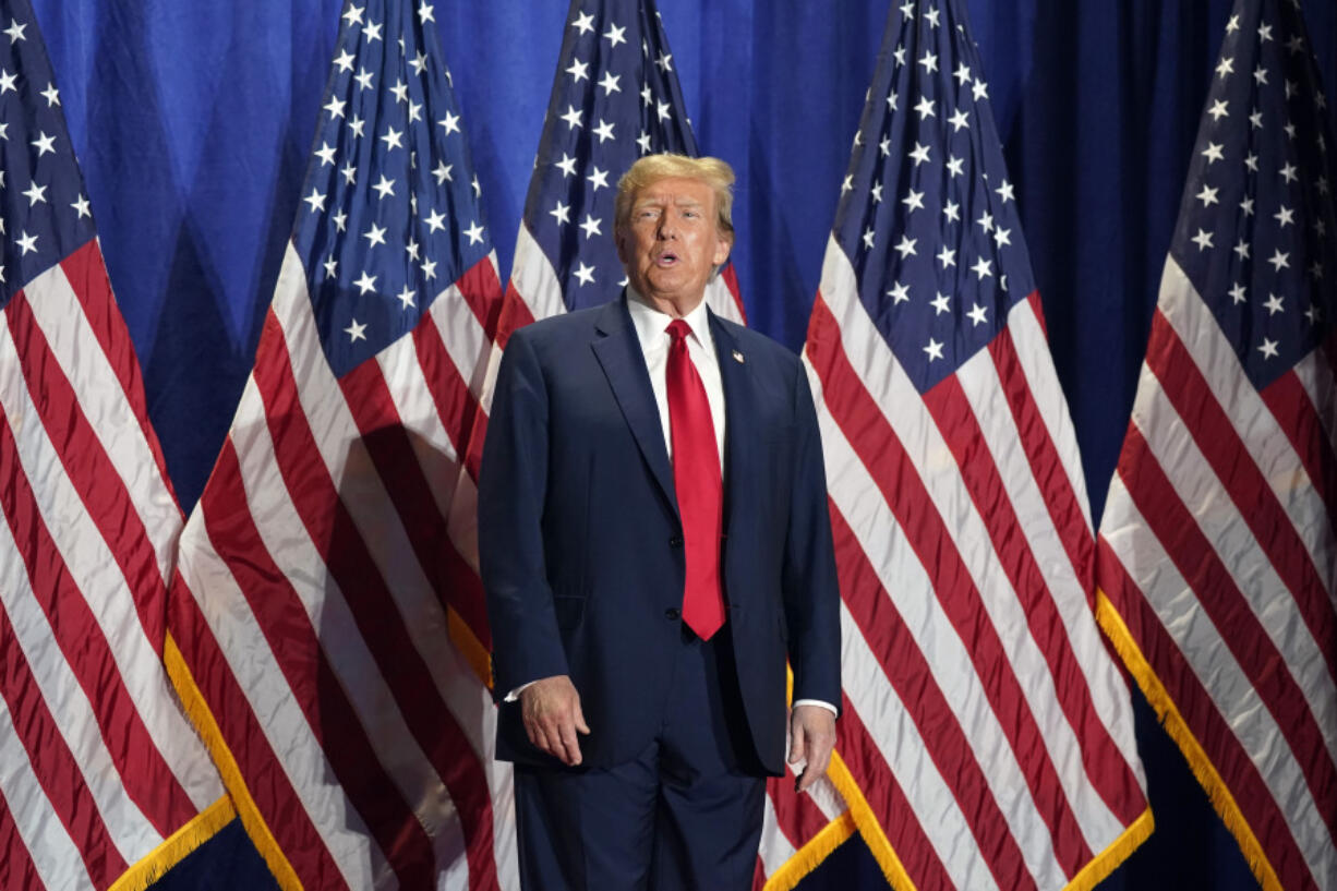 FILE - Republican presidential candidate former President Donald Trump arrives at a campaign rally Saturday, March 2, 2024, in Richmond, Va. A lawsuit settlement offers new details about how two attorneys for former President Donald Trump orchestrated a plan for fake electors to file paperwork falsely saying the Republican won Wisconsin in a strategy to overturn Democrat Joe Biden&rsquo;s 2020 victory there and in other swing states. The agreement settles a civil lawsuit filed by Democrats against the attorneys and the fake electors.