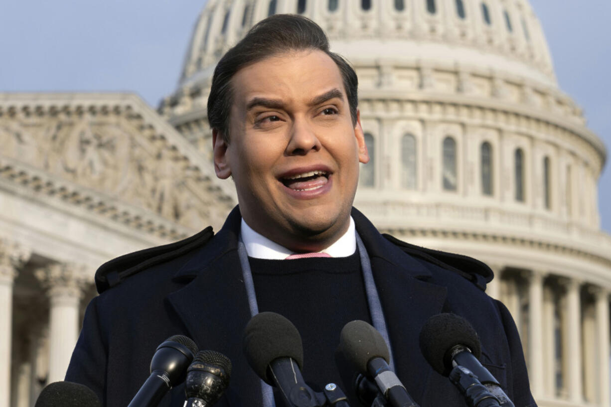 FILE - Rep. George Santos, R-N.Y., faces reporters at the Capitol, Nov. 30, 2023, in Washington. Santos, who was expelled from the House of Representatives in December and faces federal charges of defrauding donors to his 2022 campaign, announced on social media that he is running for Congress again. (AP Photo/J.