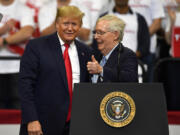 FILE - Then President Donald Trump, left, and Senate Majority Leader Mitch McConnell of Ky., greet each other during a campaign rally in Lexington, Ky., Nov. 4, 2019. McConnell has endorsed Donald Trump for president. McConnell announced his decision after Super Tuesday wins pushed Trump, who is the GOP front-runner, closer to the party nomination. It&rsquo;s a remarkable turnaround for McConnell, who has blamed Trump for &ldquo;disgraceful&rdquo; acts in the Jan. 6, 2021, attack on the Capitol. (AP Photo/Timothy D.