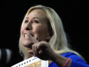 Rep. Marjorie Taylor Greene, R-Ga., talks before Republican presidential candidate former President Donald Trump speaks at a campaign rally Saturday, March 9, 2024, in Rome Ga.