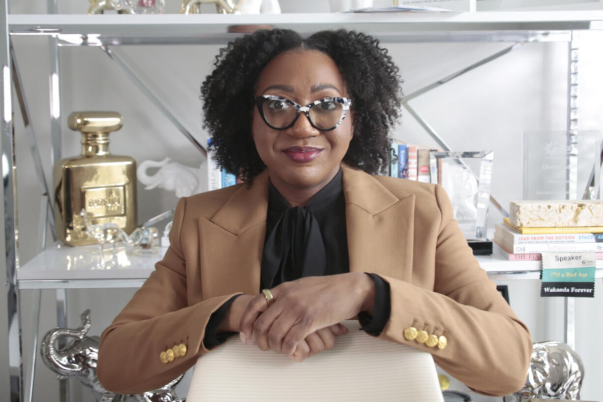 Chantel Adams, a senior marketing executive, poses in her home office Thursday, March 7, 2024, in Durham, N.C. Adams says she isn&rsquo;t surprised that the gender pay gap persists even among men and women with the same level and quality of education, or that the gap is wider for Black and Hispanic women.