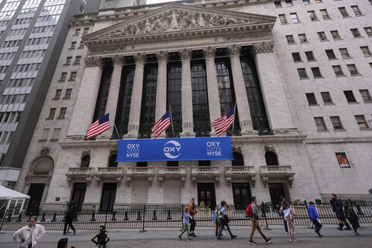 Pedestrians pass the New York Stock Exchange, Tuesday, Feb. 27, 2024, in New York.