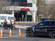 A police vehicle is parked outside Saint Alphonsus Regional Medical Center in Boise, Idaho, on Wednesday, March 20, 2024.   Three Idaho corrections officers were shot as a suspect staged a brazen attack to break Skylar Meade, a prison inmate out of the Boise hospital overnight. Two of the officers were shot by the suspect early Wednesday. The third was shot and wounded by a police officer when police mistook the correctional officer for the suspect.  (Sarah A.