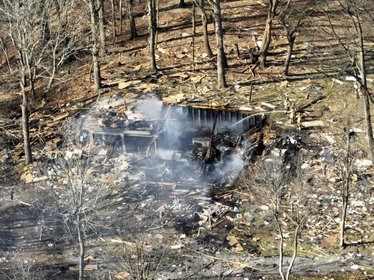 Debris remains after a house explosion on Tuesday, March 12, 2024 in Crescent Township, Pa.  Allegheny County emergency dispatchers said the blast in Crescent Township in the northwest Pittsburgh suburbs was reported at about 9 a.m. Tuesday. Police, fire and emergency services were dispatched to the scene, dispatchers said.