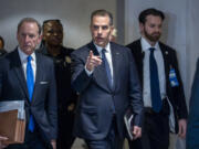 Hunter Biden, son of President Joe Biden, with attorney Abbe Lowell, left, leaves after a closed-door deposition in the Republican-led investigation into the Biden family, on Capitol Hill in Washington, Wednesday, Feb. 28, 2024. (AP Photo/J.