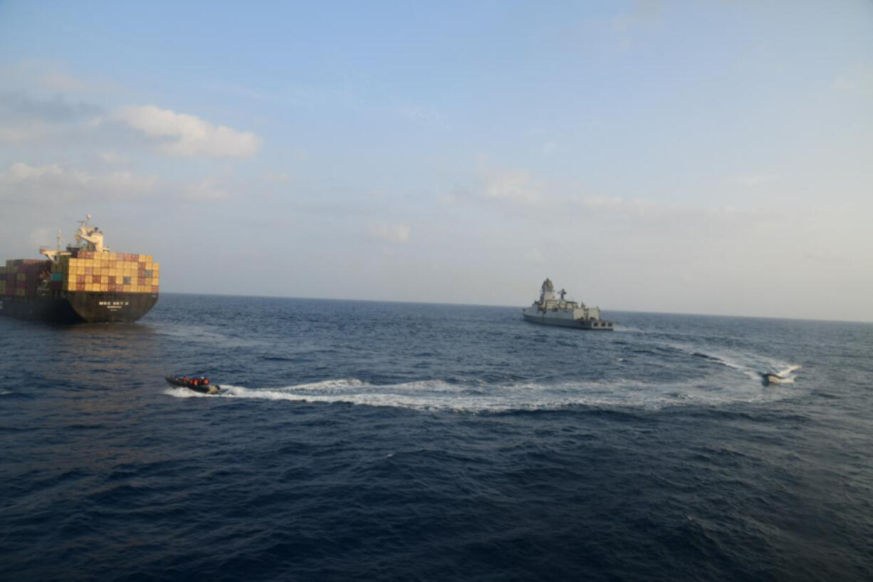 This photograph shared by Indian navy on the X platform shows a firefighting team from Indian Navy vessel INS Kolkata responding to a fire on Liberian-flagged Merchant ship MSC Sky II caused due to a suspected drone/missile attack in the Gulf of Aden, Tuesday, March 5, 2024.