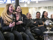 Iowa&rsquo;s Caitlin Clark, center left, and Kate Martin, left celebrate their team&rsquo;s number one seed during an NCAA Selection Sunday watch party Sunday in Iowa City, Iowa.