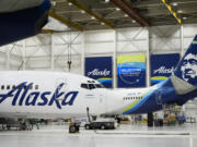 Alaska Airlines aircraft sit in the airline&rsquo;s hangar at Seattle-Tacoma International Airport Wednesday, Jan. 10, 2024, in SeaTac, Wash. Boeing has acknowledged in a letter to Congress that it cannot find records for work done on a door panel that blew out on an Alaska Airlines flight over Oregon two months ago. Ziad Ojakli, Boeing executive vice president and chief government lobbyist, wrote to Sen.