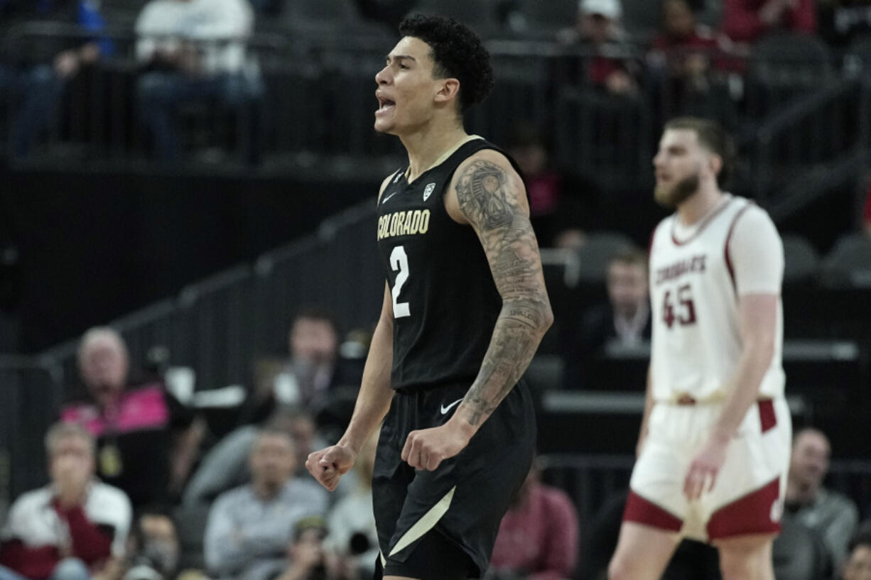 Colorado guard KJ Simpson (2) celebrates after a play against Washington State during the second half of an NCAA college basketball game in the semifinal round of the Pac-12 tournament Friday, March 15, 2024, in Las Vegas.