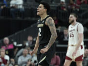 Colorado guard KJ Simpson (2) celebrates after a play against Washington State during the second half of an NCAA college basketball game in the semifinal round of the Pac-12 tournament Friday, March 15, 2024, in Las Vegas.