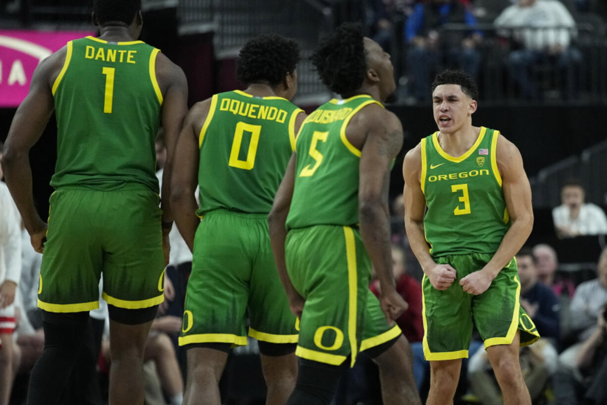 Oregon guard Jackson Shelstad (3) celebrates after a play against Arizona during the second half of an NCAA college basketball game in the semifinal round of the Pac-12 tournament Friday, March 15, 2024, in Las Vegas.