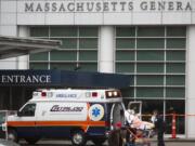 FILE - A patient arrives at the Massachusetts General Hospital emergency entrance, Friday, April 3, 2020, in Boston.  Doctors in Boston say they have transplanted a genetically modified pig kidney into a 62-year-old patient. Massachusetts General Hospital said Thursday, March 21, 2024, it&rsquo;s the first time a pig kidney has been transplanted into a living person.