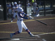 Mallory Vancleave of Ridgefield fouls off a pitch during a game against Olympic at the Ridgefield Outdoor Recreation Center on Saturday, March 16, 2024.