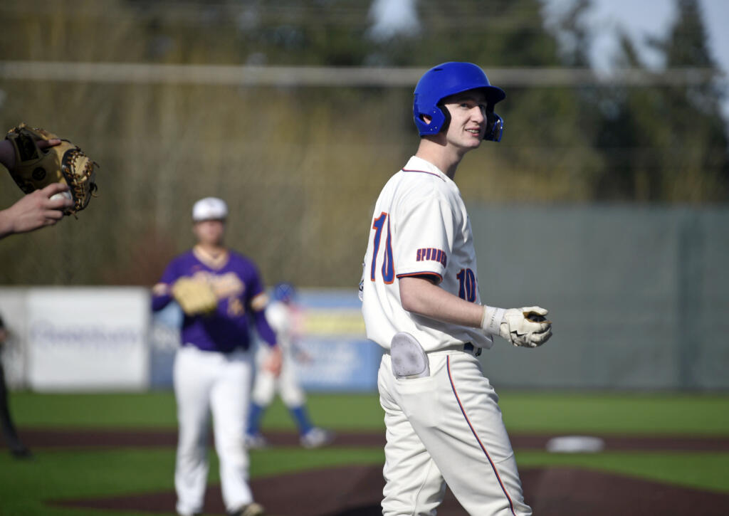 Ridgefield's Landon DeBeaumont looks back toward the stands after fouling off a pitch against Columbia River during a 2A GSHL baseball game on Friday, March 29, 2024, at Ridgefield Outdoor Recreation Complex.