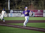 Columbia River third baseman Nate Little (6) turns to throw to first base for an out against Ridgefield during a 2A GSHL baseball game on Friday, March 29, 2024, at Ridgefield Outdoor Recreation Complex.