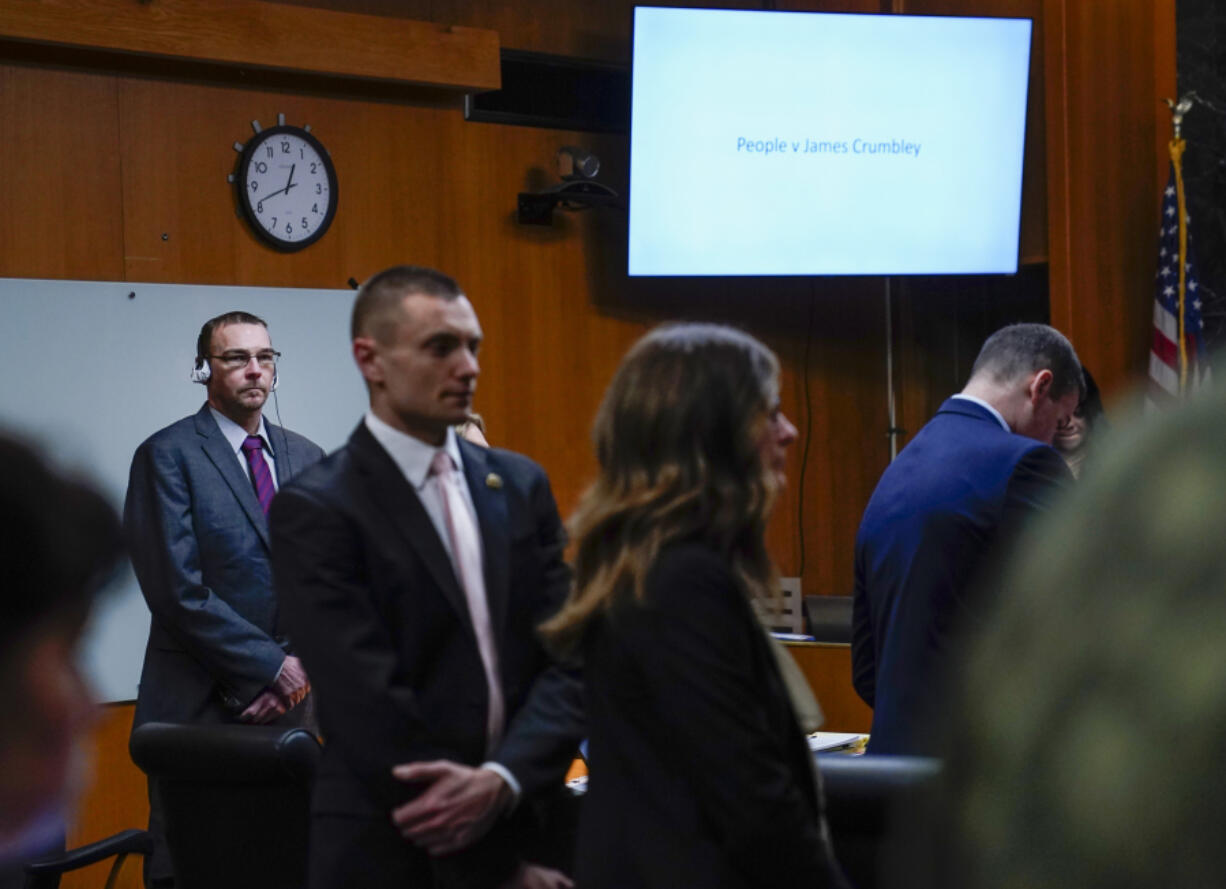 Closing arguments begin in the trial against James Crumbley, standing at left, in the Oakland County Courtroom of Cheryl Matthews, Wednesday, March, 13, 2024 in Pontiac, Mich. Crumbley is charged with involuntary manslaughter, accused of failing to secure a gun at home and ignoring his son&rsquo;s mental health. Ethan Crumbley killed four students at Oxford High School in 2021. Jury deliberations are set to resume Thursday.