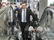 Sen. Chris Murphy, D-Conn., rides an escalator at the Senate subway on Capitol Hill Tuesday, March 12, 2024, in Washington.