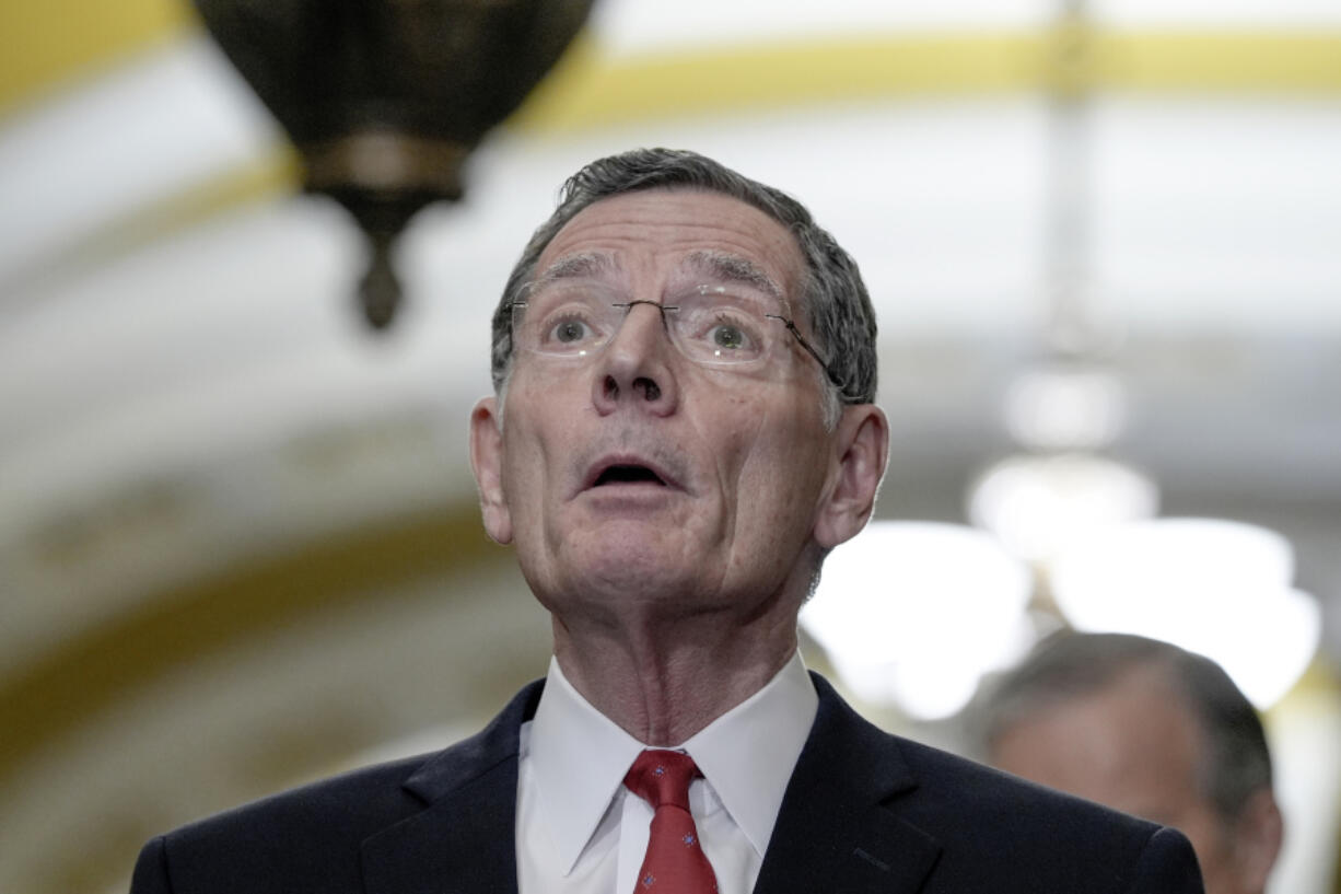 Senator John Barrasso, R-Wyo., left, talks after a policy luncheon on Capitol Hill Tuesday, Feb. 27, 2024, in Washington.