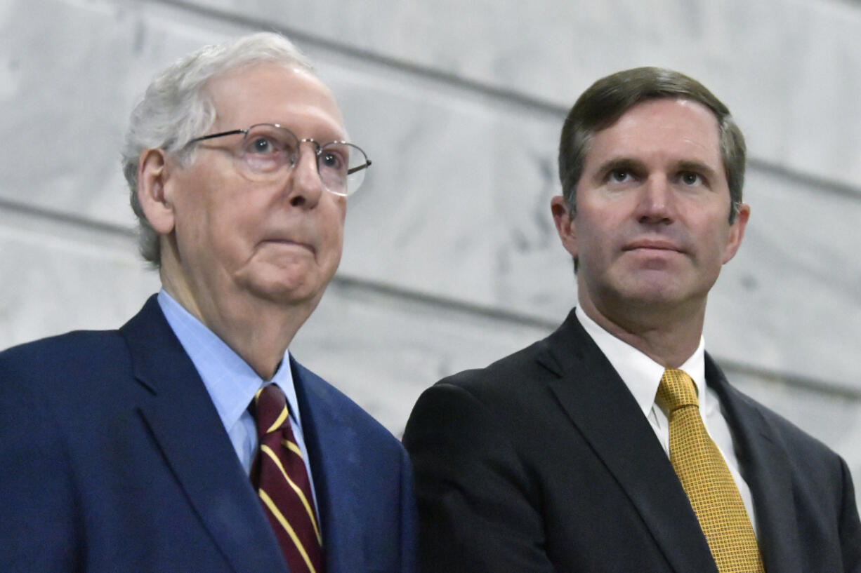 FILE - Senate Minority Leader Mitch McConnell, R-Ky., left, speaks with Kentucky Gov. Andy Beshear during a ceremony in the Rotunda at the Kentucky State Capitol in Frankfort, Ky., Jan. 2, 2024.  Kentucky lawmakers on Thursday, March 28 gave final approval to a bill stripping the state&rsquo;s Democratic governor of any role in picking someone to occupy a U.S. Senate seat if a vacancy occurred in the home state of McConnell.(AP Photo/Timothy D.