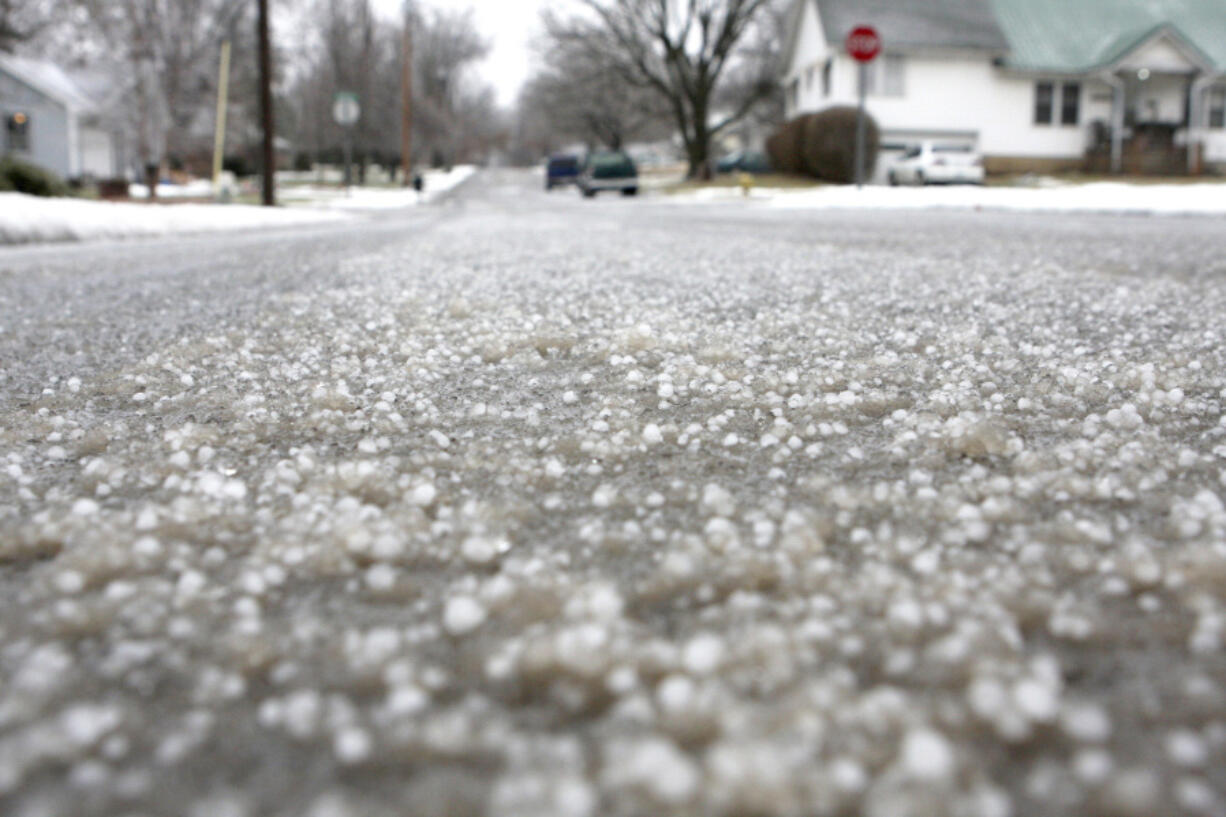 FILE - Hail stones cover the streets, Jan. 20, 2010, in Kirksville, Mo. Volatile weather is expected to hone in on parts of Kansas and Missouri on Wednesday night, March 13, 2024, and the biggest worry is the potential for massive chunks of hail.