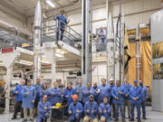 This photo provided by NASA shows three APEP rockets at NASA Wallops Flight Facility on Wallops Island, Va., on Feb. 21, 2024, with Mission Principal Investigator Dr. Barjatya, top left, and NASA Mission Manager Jay Scott, top right, and Embry-Riddle Aeronautical University and NASA personnel. During the April 8, 2024 total solar eclipse, the rockets will blast off with science instruments into the electrically charged portion of the atmosphere near the edge of space known as the ionosphere.