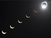 FILE - The progression of a total solar eclipse is seen in a multiple exposure photograph taken in 5-minute intervals, with the moon passing in front of the sun above Siem Reap in northwestern Cambodia, 225 kilometers (140 miles) from Phnom Penh, on Tuesday, Oct. 24, 1995.