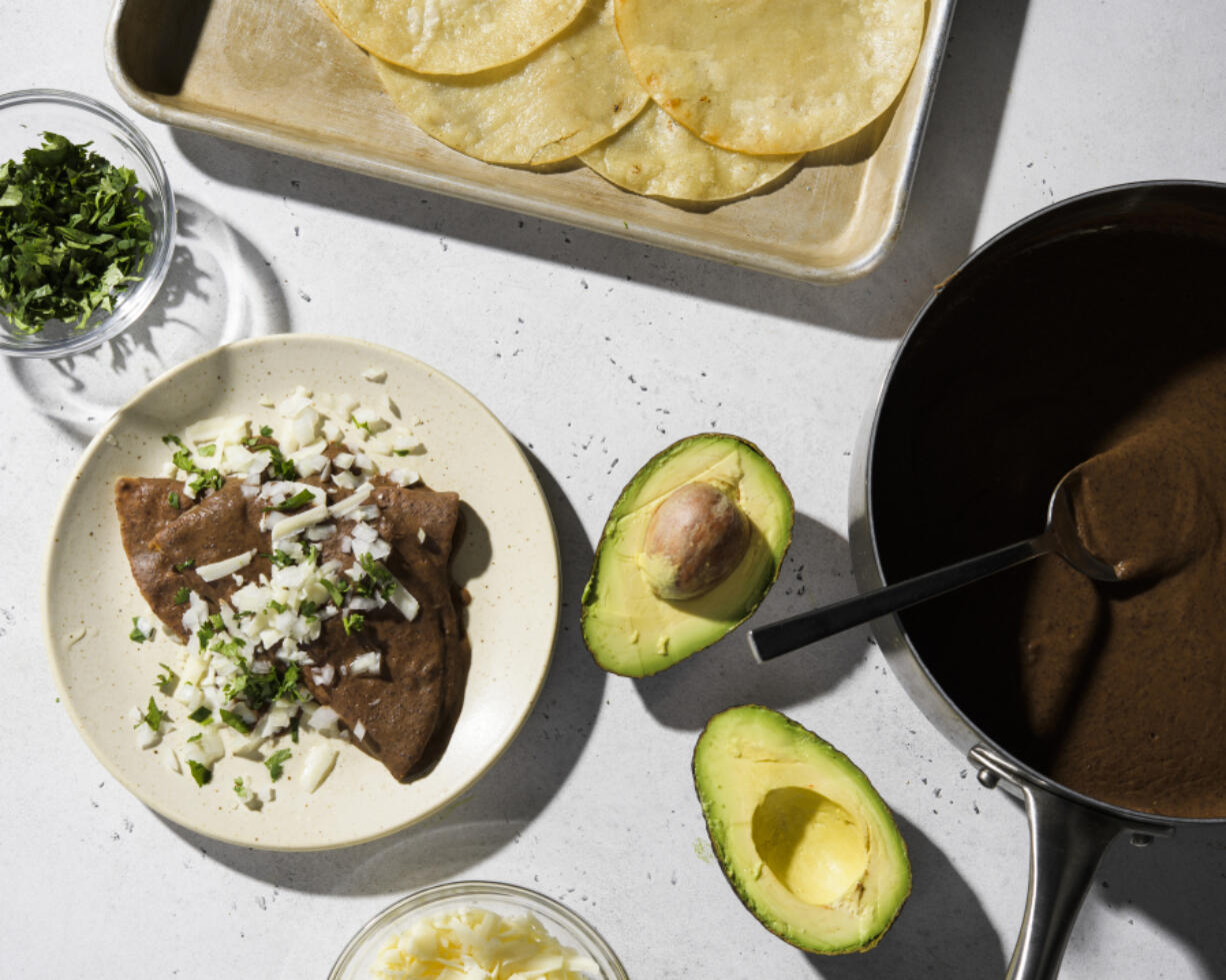 Black Bean Enfrijoladas draws on pantry staples for an easy meal.