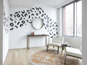 Wall stickers add a graphic element to this reading area.