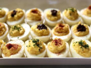 Deviled eggs just dusted with paprika are always a favorite.