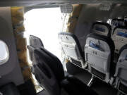 In this National Transportation Safety Board (NTSB) handout, an opening is seen in the fuselage of Alaska Airlines Flight 1282 Boeing 737-9 MAX on Jan. 7, 2024, in Portland, Oregon. A door-sized section near the rear of the Boeing 737-9 MAX plane blew off 10 minutes after Alaska Airlines Flight 1282 took off from Portland, Oregon, on Jan. 5 on its way to Ontario, California.