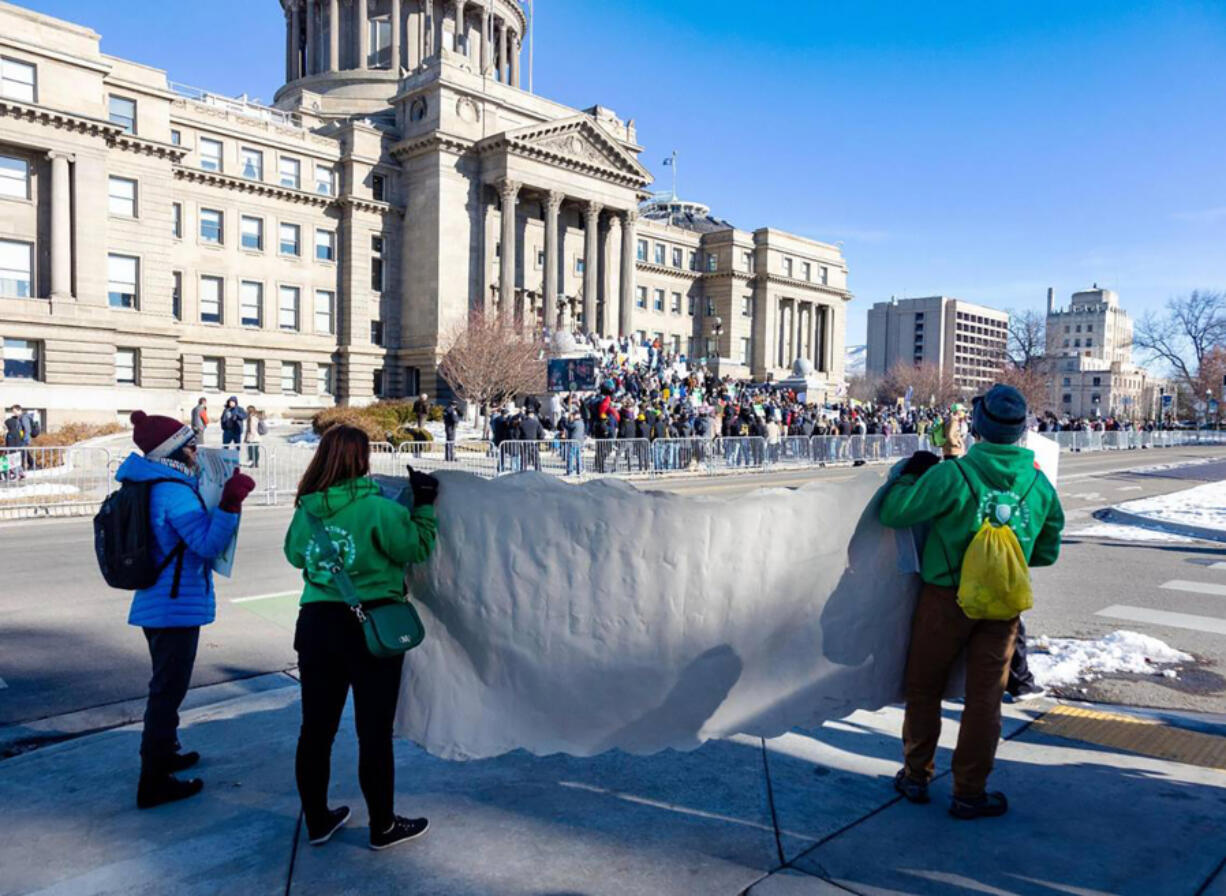 People against a new abortion ban protest across the street from the March for Life rally at the Idaho Capitol on Jan. 21, 2023, in Boise, Idaho. (Sarah A.