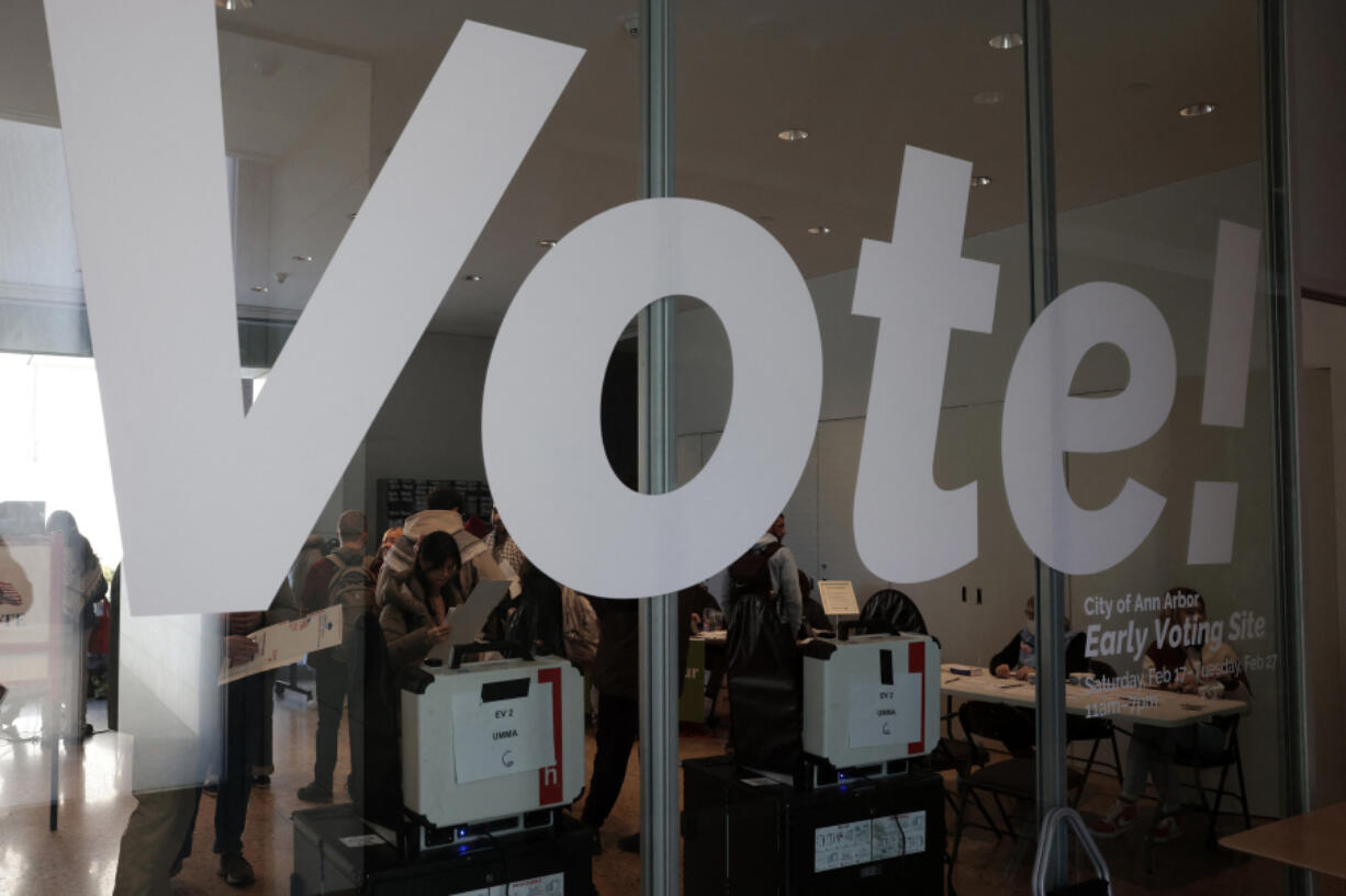 People cast their ballots during early voting in the state&rsquo;s primary on the campus of the University of Michigan in Ann Arbor, Michigan on Feb. 20, 2024.