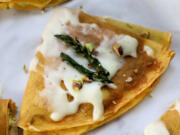 Pureed asparagus blended with fresh ricotta is a seasonal filling for these savory crepes.