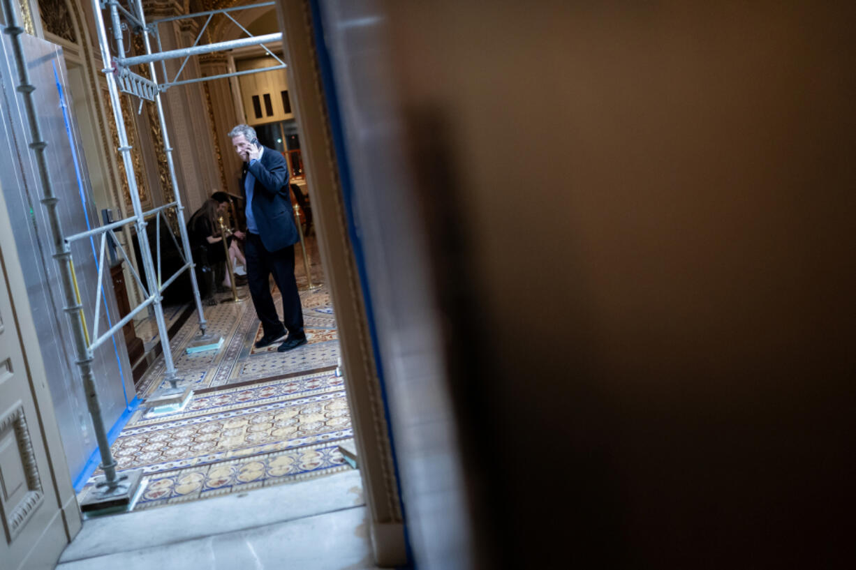 U.S. Sen. Sherrod Brown (D-OH) talks on the phone near the Senate Chambers on March 23, 2024, in Washington, DC. The House of Representatives passed a $1.2 trillion spending bill to fund the government through September and avert a partial shutdown. The legislation will now go to the Senate for consideration.