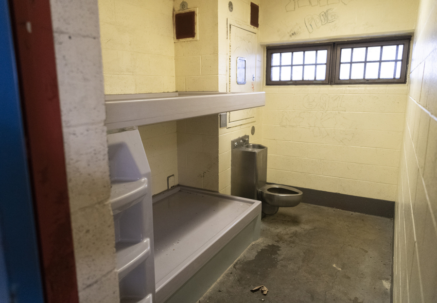 Beds, a toilet and sink sit inside a jail cell at the Clark County Jail.