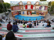 Patrons watch a holiday show featuring sea lions Clyde and Seamore in a spoof of a nighttime television Christmas special at Sea World San Diego on Nov. 16, 2020, in San Diego, Calif. (K.C.